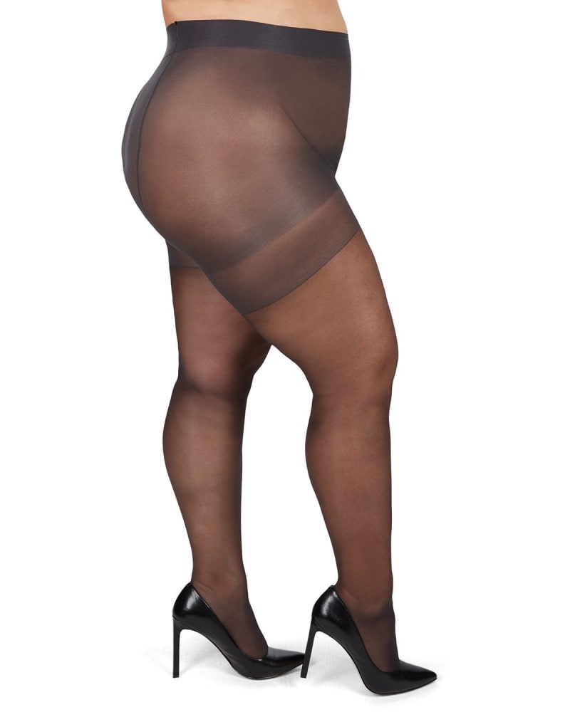 Side of a model wearing a size 7X Energizing Plus Size Curvy Control Top Pantyhose in Off Black by Memoi. | dia_product_style_image_id:299741